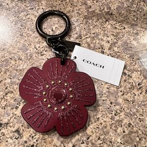 Coach tea rose bag charm.